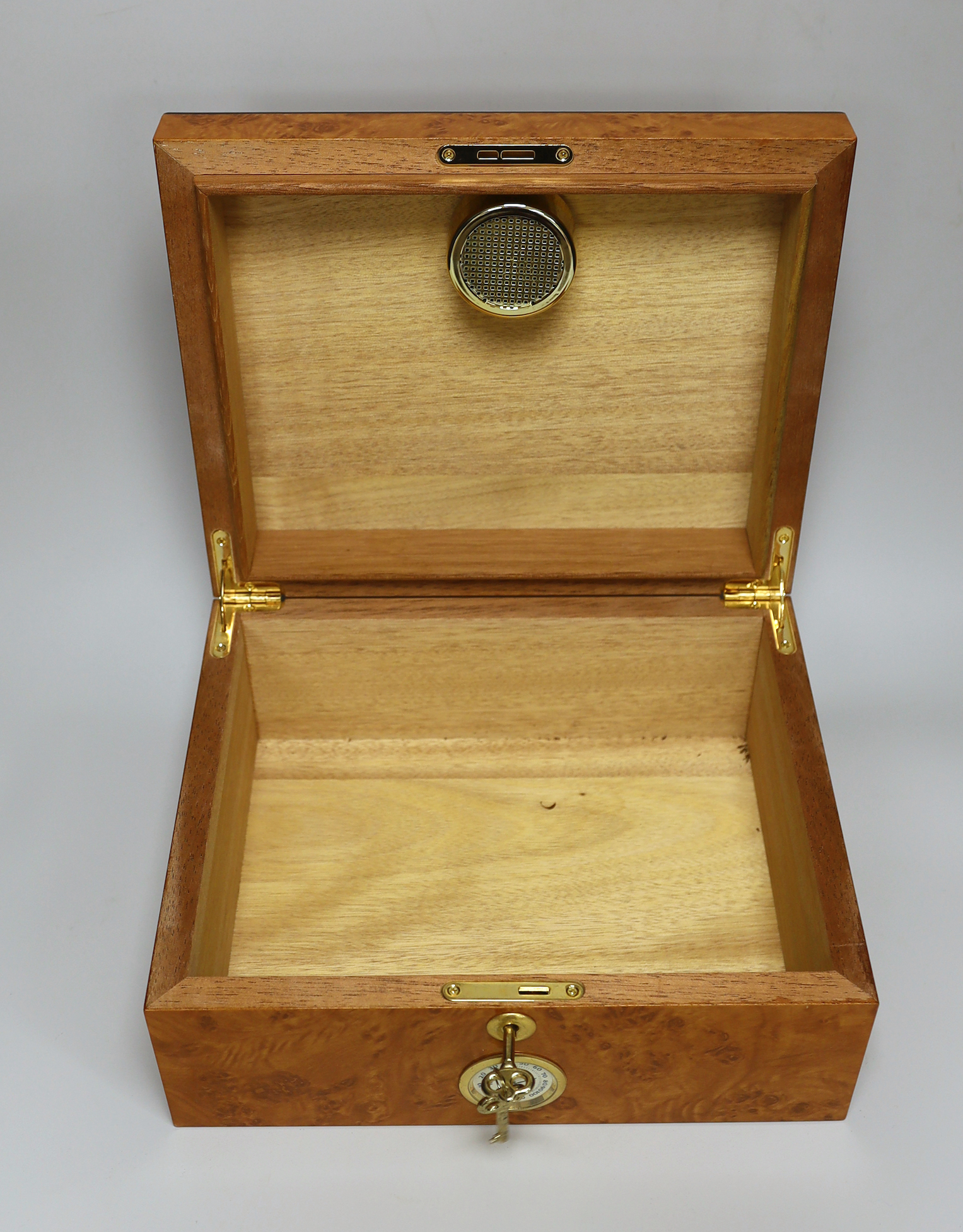 A thuya wood humidor with key, 12.5cm high x 29cm wide